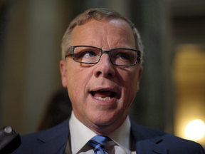 Premier Brad Wall speaks with members of the media following the 2017 budget speech at the Legislative Building in Regina Wednesday, March 22, 2017.