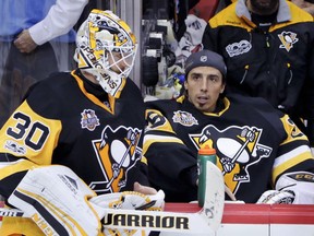 Pittsburgh Penguins goalies Matt Murray (left) and Marc-Andre Fleury talk during a game against the Ottawa Senators on May 21.