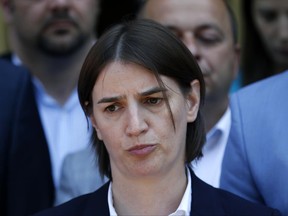 In this photo taken Friday, June 16, 2017, Serbia's Prime Minister-designate Ana Brnabic speaks to media in Vrnjacka Banja, Serbia. The ruling conservatives say that if Serbia's Prime Minister-designate Ana Brnabic does not get enough votes to be confirmed by parliament as the first openly gay person to head the country's government, early general elections would be held. (AP Photo/Darko Vojinovic)