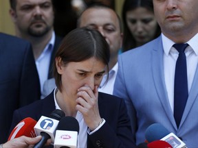 In this photo taken Friday, June 16, 2017, Serbia's Prime Minister-designate Ana Brnabic speaks to media in Vrnjacka Banja, Serbia. Serbia's future first woman and openly gay prime minister Ana Brnabic has proposed the staunchly pro-Russian official, and former Labor Minister Aleksandar Vulin as the defense minister, damping hopes in the west that her nomination signals the country's shift away from Moscow's influence. (AP Photo/Darko Vojinovic)