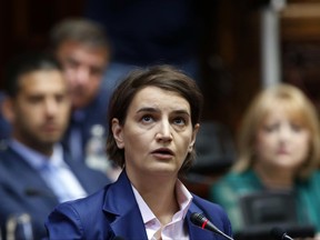 Serbia's Prime Minister-designate Ana Brnabic addresses the parliament in Belgrade, Serbia, Wednesday, June 28, 2017. Brnabic is expected to take office this week after a vote in parliament, which is considered a formality. (AP Photo/Darko Vojinovic)