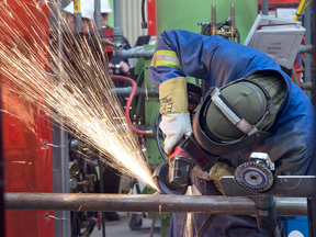 Workers construct components of the Canadian Navy’s new Arctic Offshore Patrol Ships at the Irving shipbuilding facility in Halifax