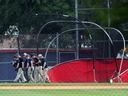 Investigators search for evidence at the Eugene Simpson Stadium Park where a man shot Republican baseball players on June 14, 2017 in Alexandria, Virginia.