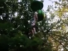 Video posted online shows a teenager dangling from a gondola at New York state amusement park.