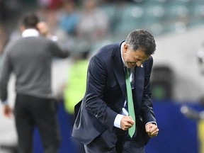 Mexico coach Juan Carlos Osorio celebrates during the Confederations Cup, Group A soccer match between Mexico and New Zealand, at the Fisht Stadium in Sochi, Russia, Wednesday, June 21, 2017. Mexico won 2-1. (AP Photo/Martin Meissner)