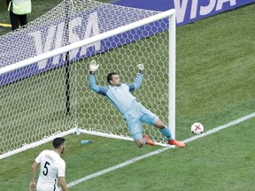 New Zealand goalkeeper Stefan Marinovic makes a save during the Confederations Cup, Group A soccer match between New Zealand and Portugal, at the St. Petersburg Stadium, Russia, Saturday, June 24, 2017. (AP Photo/Dmitri Lovetsky)