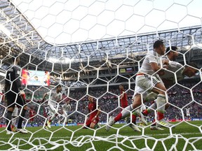 Mexico's Hector Moreno, right, celebrates with his teammates scoring his side's second goal during the 2017during the Confederations Cup, Group A soccer match between Portugal and Mexico, at the Kazan Arena, Russia, Sunday, June 18, 2017. (AP Photo/Martin Meissner)