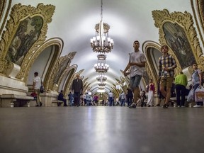 People walk at Kievskaya subway (Metro) station in Moscow, Russia, Tuesday, June 20, 2017. The Moscow subway hopes to provide an easy, safe and cheap way to travel around Moscow during the Confederations Cup or next year's World Cup. (AP Photo/Alexander Zemlianichenko)