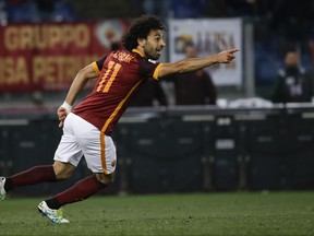 FILE - In this Monday, April 11, 2016 file photo, Roma's Mohammed Salah celebrates after scoring during their Serie A soccer match against Bologna, in Rome's Olympic stadium. Egypt winger Mohamed Salah will get another chance to prove himself in the English Premier League after sealing a move to Liverpool from Roma on Thursday, June 22, 2017. The 25-year-old Salah made just six league starts during his time playing for Chelsea from February 2014 to February 2015 before being sent on loan first to Fiorentina and then Roma. (AP Photo/Gregorio Borgia, file)
