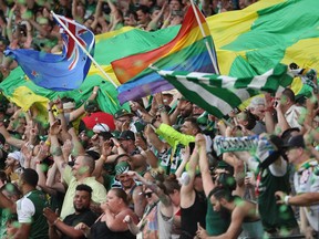 The Portland Timbers fans celebrates Fanendo Adi's penalty kick goal in the first half of an MLS soccer game against the Seattle Sounders on Sunday, June 25, 2017, at Providence Park in Portland, Ore. (Pete Christopher/The Oregonian via AP)