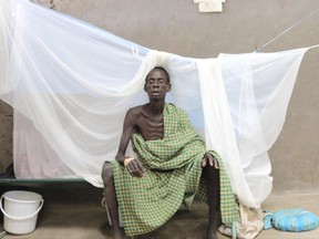 Machar Weituor sits on his bed  at a cholera clinic in Pieri South Sudan on Wednesday June 28 2017 . More than 11,000 cases of cholera have been reported since South Sudan's outbreak began one year ago, with at least 190 deaths. The World Health Organization says 2017 shows a slight increase in cholera cases. (AP Photo/Sam Mednick) "