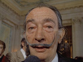 This May 21, 1973 file photo shows Spanish surrealist painter Salvador Dali, presents his first Chromo-Hologram in Paris, France.