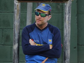 FILE - In this Tuesday, March 14, 2017 file photo, Sri Lankan cricket team coach Graham Ford watches his team members during a practice session prior to their test cricket match against Bangladesh in Colombo, Sri Lanka. Sri Lanka Cricket announced on Saturday June 24, 2017, Graham Ford is stepping down as head coach of Sri Lanka's cricket team, ending his second spell in charge after 18 months. (AP Photo/Eranga Jayawardena, File)