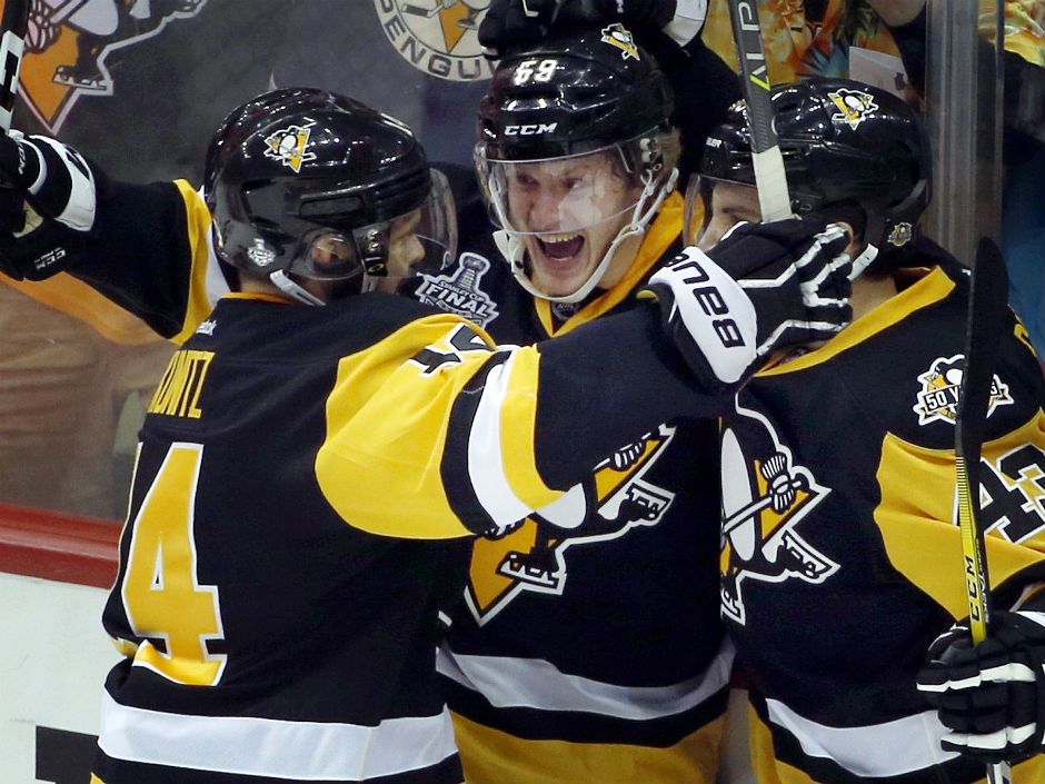 Olli Maatta, of London, England shakes hands with Pittsburgh