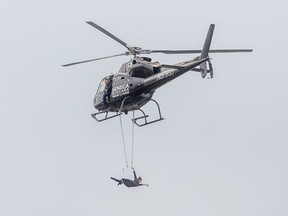 Aerialist Erendira Wallenda completed her stunt by hanging from a helicopter over the Horseshoe Falls in Niagara Falls Thursday June 15 2017 Wallenda is the wife of Nick Wallenda who tightrope walked over the same spot five years ago.