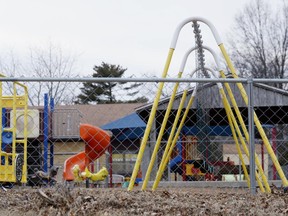 FILE - In this Jan. 26, 2016 file photo, the empty playground at Trinity Lutheran Church in Columbia, Mo. The Supreme Court has ruled that churches have the same right as other charitable groups to seek state money for new playground surfaces and other non-religious needs. The justices on Monday, June 26, 2017, ruled 7-2 in favor of Trinity Lutheran Church of Columbia, Missouri. The church sought a grant to put a soft surface on its preschool playground, but was denied any money even though its application was ranked fifth out of 44 submissions (Annaliese Nurnberg/Missourian via AP, File)