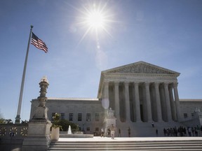 People visit the Supreme Court in Washington, Monday, June 26, 2017, as justices issued their final rulings for the term, in Washington.  The Supreme Court began its term nine months ago with Merrick Garland nominated to the bench, Hillary Clinton favored to be the next president, and the court poised to be controlled by Democratic appointees for the first time in 50 years.  Things looked very different when the justices wrapped up their work this week.   (AP Photo/J. Scott Applewhite)
