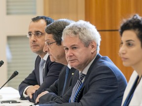 The Greek Cypriot delegation with Greek Cypriot leader, Nicos Anastasiades, center, is pictured at the beginning of a new round of the conference on Cyprus under the auspices of the United Nations, in Crans-Montana, Switzerland, Wednesday, June 28, 2017. (Jean-Christophe Bott/Keystone via AP)