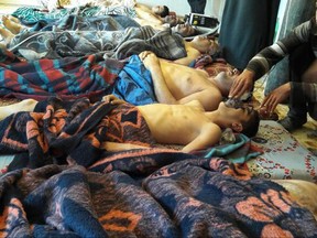 In this April 4, 2017 file photo, victims of a suspected chemical weapons attack lie on the ground, in Khan Sheikhoun, in the northern province of Idlib, Syria. An international watchdog confirmed Friday the gas employed was, in fact, Sarin.