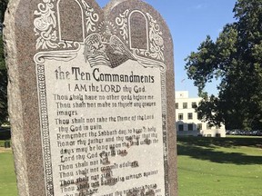 A 6-foot-tall privately funded Ten Commandments monument is seen on the Arkansas Capitol grounds in Little Rock on Tuesday, June 27, 2017, after it was installed by workers two years after lawmakers approved a measure allowing the statue on state property. (AP Photo/Jill Zeman Bleed)