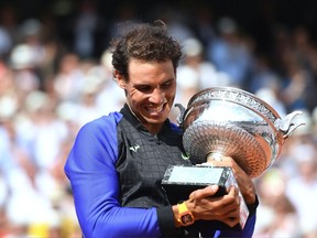 Rafael Nadal holds the French Open trophy on June 11.