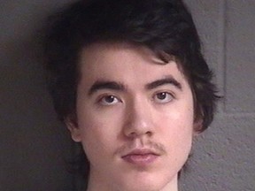 This undated booking photo provided by Buncombe County Detention Facility, shows North Carolina resident Justin Nojan Sullivan, who was sentenced to life in prison on Tuesday, June 27, 2017, for a foiled terror plot inspired by the Islamic State group. He pleaded guilty in late 2016 to one count of attempting to commit an act of terrorism. He was arrested in 2015 after authorities say he plotted to kill hundreds at a nightclub or concert. (Buncombe County Detention Facility via AP)