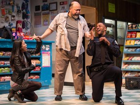 Actors (left to right) Rosie Simon, Paul Sun-Hyung Lee and Ronnie Rowe Jr. are shown in a handout photo from the Soulpepper Theatre Company's play "Kim's Convenience" THE CANADIAN PRESS/ HO-Cylla von Tiedemann MANDATORY CREDIT