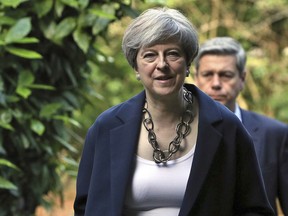 Britain's Prime Minister Theresa May attends Holy Communion at St Andrew's Church in Sonning, Berkshire, England, Sunday, June 11, 2017.