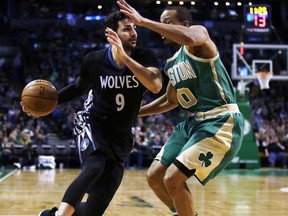 FILE - In this March 15, 2017, file photo, Minnesota Timberwolves' Ricky Rubio (9) tries to drive past Boston Celtics' Avery Bradley (0) during the second half of an NBA basketball game in Boston. The Timberwolves have reached an agreement to Rubio to the Utah Jazz to clear salary cap space for a big run in free agency. A person with direct knowledge of the deal tells The Associated Press the two sides agreed to the move on Friday, June 30, 2017, hours before free agency opened. (AP Photo/Charles Krupa, File)