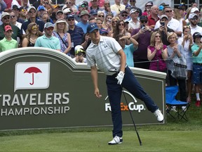 Jordan Spieth watches his drive from the first tee at the Travelers Championship at TPC River Highlands, Wednesday, June 21, 2017 in Cromwell, Conn. (Patrick Raycraft/Hartford Courant via AP)