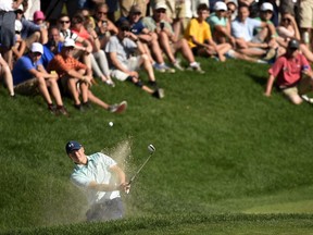 Jordan Spieth hits from the greenside bunker on the 15th hole during the third round of the Travelers Championship golf tournament Saturday, June 24, 2017, in Cromwell, Conn. (John Woike/Hartford Courant via AP)