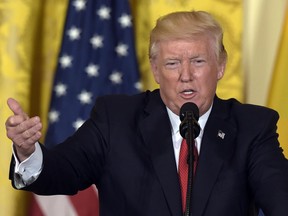 President Donald Trump speaks in the East Room of the White House in Washington. A White House official says President Donald Trump is expected to withdraw the United States from the Paris climate accord.