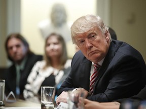 President Donald Trump meets with what the White House identifies as "immigration crime victims" to urge passage of House legislation to save American lives, Wednesday, June 28, 2017, in the Cabinet Room at the White House in Washington. (AP Photo/Manuel Balce Ceneta)