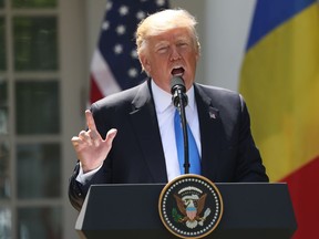 President Donald Trump speaks during a news conference with Romanian President Klaus Werner Iohannis, in the Rose Garden at the White House, Friday, June 9, 2017, in Washington.  Donald Trump is trying to change the subject from scandal back to his promise to make American job creation a top priority. "We want to get back to running our great country," Trump said Friday at a White House news conference.   (AP Photo/Andrew Harnik)