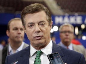 In this July 17, 2016 file photo, then-Donald Trump campaign chairman Paul Manafort talks to reporters on the floor of the Republican National Convention, in Cleveland.