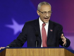 FILE- In this Nov. 9, 2016, file photo, John Podesta, campaign chairman, announces that Democratic presidential nominee Hillary Clinton will not be making an appearance at Jacob Javits Center in New York. Podesta met with a House committee investigating Russia's interference in the 2016 presidential election behind closed doors on Tuesday, June 27, 2017. The hacking of Podesta's personal email account and the release of those emails by Wikileaks during the late stages of the campaign is a focus of the committee's investigation. (AP Photo/Patrick Semansky, File)