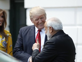 President Donald Trump and first lady Melania Trump greet Indian Prime Minister Narendra Modi to the White House in Washington, Monday, June 26, 2017.  (AP Photo/Alex Brandon)