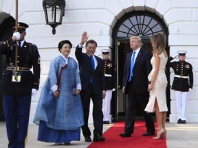 President Donald Trump and first lady Melania Trump welcome South Korean President Moon Jae-in and his wife Kim Jung-sook on the South Portico at the White House in Washington, Thursday, June 29, 2017. (AP Photo/Manuel Balce Ceneta)