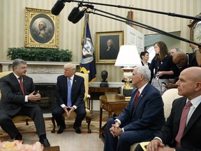 President Donald Trump listens as Ukrainian President Petro Poroshenko speaks during a meeting in the Oval Office of the White House, Tuesday, June 20, 2017, in Washington. From left, Poroshenko, Trump, Vice President Mike Pence, and National Security Adviser H.R. McMaster. (AP Photo/Evan Vucci)