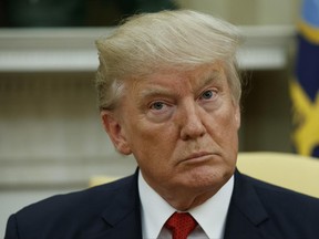 President Donald Trump listens in the Oval Office of the White House in Washington, Monday, June 26, 2017. Democrats are out to capitalize on what they believe is growing public sentiment that President Donald Trump, the richest man to call the White House home, is turning his back on the regular people who got him elected in favor of his wealthy peers. The party is hoping that pitch will pack extra oomph at a time when even some Republicans are raising concerns that the GOP health-care plan could hurt the poor.  (AP Photo/Evan Vucci)