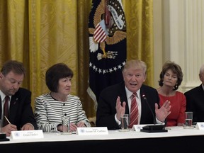 President Donald Trump, center, speaks as he meets with Republican senators on health care in the East Room of the White House in Washington, Tuesday, June 27, 2017. Seated with him, from left, are Sen. Dean Heller, R-Nev., Sen. Susan Collins, R-Maine, Sen. Lisa Murkowski, R-Alaska, and Sen. Orrin Hatch, R-Utah. (AP Photo/Susan Walsh)