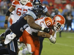 B.C. Lions quarterback Jonathon Jennings tries to elude Victor Butler of the Toronto Argonauts during the Lions' win at BMO Field in Toronto on Friday, June 30, 2017.