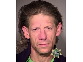 This police booking photo obtained June 3, 2017 courtesy of the Portland Police shows  George Tschaggeny, suspected of stealing the wedding ring and backpack of one of two men fatally stabbed on a commuter train on May 26, 2017 in Portland, Oregon.