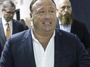 In this Monday, April 17, 2017, photo, "Infowars" host Alex Jones arrives at the Travis County Courthouse in Austin, Texas. Conspiracy theorist Jones hemmed and hawed Sunday, June 18, when pressed repeatedly by Megyn Kelly to admit he was wrong to call the massacre at Newton, Conn., a hoax.