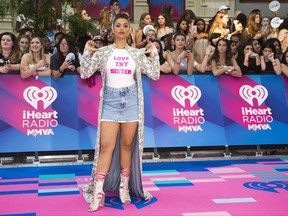 Lilly Singh arrives on the red carpet at the 2017 Much Music Video Awards in Toronto on Sunday, June 18, 2017. THE CANADIAN PRESS/Nathan Denette