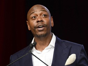 FILE - In this July 18, 2015 file photo, comedian Dave Chappelle speaks at the RUSH Philanthropic Arts Foundation's Art for Life Benefit in New York.  Chappelle will host Rihanna's annual charity event in September and Kendrick Lamar will perform. Rihanna said in a statement Tuesday, June 20, 2017,  she's "thrilled that the incomparable Dave Chappelle will kick things off as the official host" and said Lamar, whom she has collaborated with, "will take the stage for an unforgettable performance." (Photo by Scott Roth/Invision/AP, File)