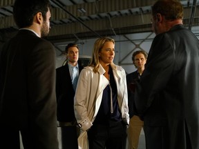 This image released by CBS shows, from left, Jason Bowen as Anis Musse, Erich Bergen as Blake Moran, Tea Leoni as Elizabeth McCord, Sebastian Arcelus as Jay Whitman, and Elya Baskin as Dito Pirosmani in a scene from "Madam Secretary." Writing TV shows based on real life in Washington has always been a challenge. But since Donald Trump became president, writers of such series as "Madam Secretary," "House of Cards" and "Veep" say their job is tougher than ever. The twists and turns of the Trump Administration keep the writers on their toes as they attempt to create their own make-believe plot twists that won't seem dull by comparison.  (Sarah Shatz/CBS via AP)