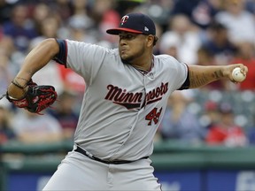 Minnesota Twins starting pitcher Adalberto Mejia delivers in the first inning of the team's baseball game against the Cleveland Indians, Friday, June 23, 2017, in Cleveland. (AP Photo/Tony Dejak)