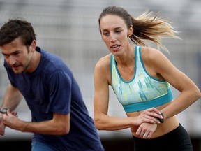 FILE - In this May 8, 2017, file photo, Gabriele Grunewald trains at Macalester College in St. Paul, Minn. Grunewald is two weeks into chemotherapy to treat cancer that's gone from her salivary gland to her liver. That won't keep her from taking the starting line for the 1,500 meters Thursday, June 22, at the U.S. track and field championships. (Carlos Gonzalez/Star Tribune via AP, File)