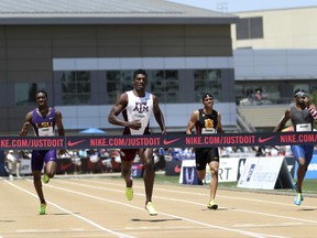 Fred Kerley, third from left, wins the men's 400 meters at the U.S. Track and Field Championships, Saturday, June 24, 2017, in Sacramento, Calif. Gil Roberts, left, came in second, and Wil London III, right, finished third. (AP Photo/Rich Pedroncelli)